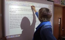 Teacher highlighting on a smartboard