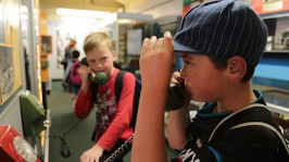 Students exploring old dial phones.