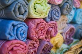 Rolls of brightly coloured fabrics