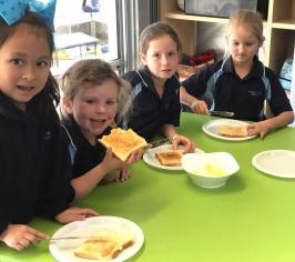 children eating toast with butter they made