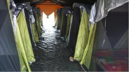 Image of accommodation tents inside larger tent