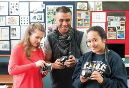 Students with digital cameras with their teacher