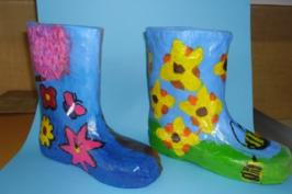 Two papier mache gumboots made by students