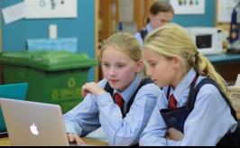 Two students planning using a computer