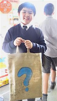 Student holding his library bag