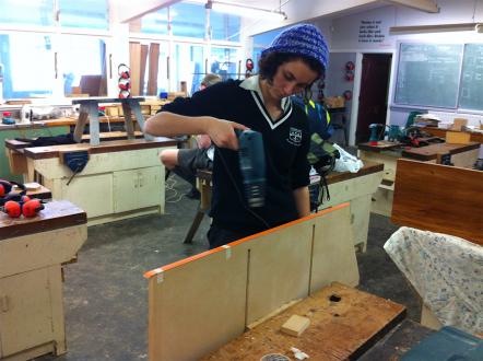 Year 13 student drilling into MDF sides.