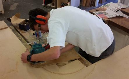 Student using saw.