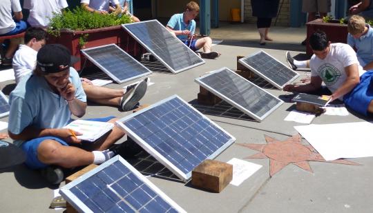 Students testing their photo voltaic water heating systems