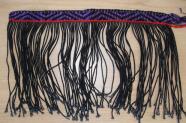 Example of student weaving with the first strip of design completed