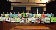 Students show their prints at assembly