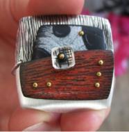 A Karash pendant with rivets