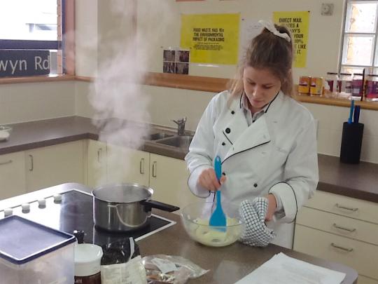student preparing food