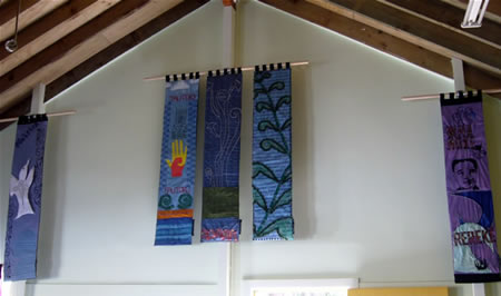 A wall in the wharenui showing the panels hanging
