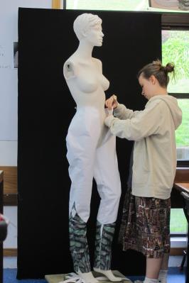Maia fitting the pants on the mannequin