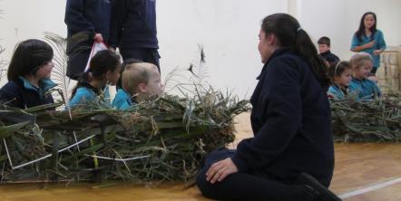 Year 6 students trying the size of the nests