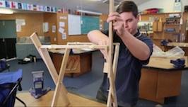 Student making a wooden chair