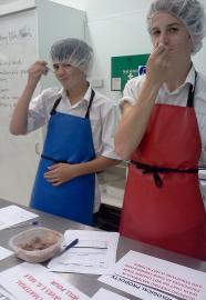 Two students completing sensory evaluation of chocolate ice cream