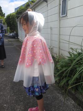 Child in designed raincoat