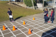 Students with an outdoor grid writing instructions for a kidbot