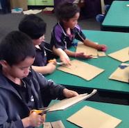 Students making cardboard models of the shade houses